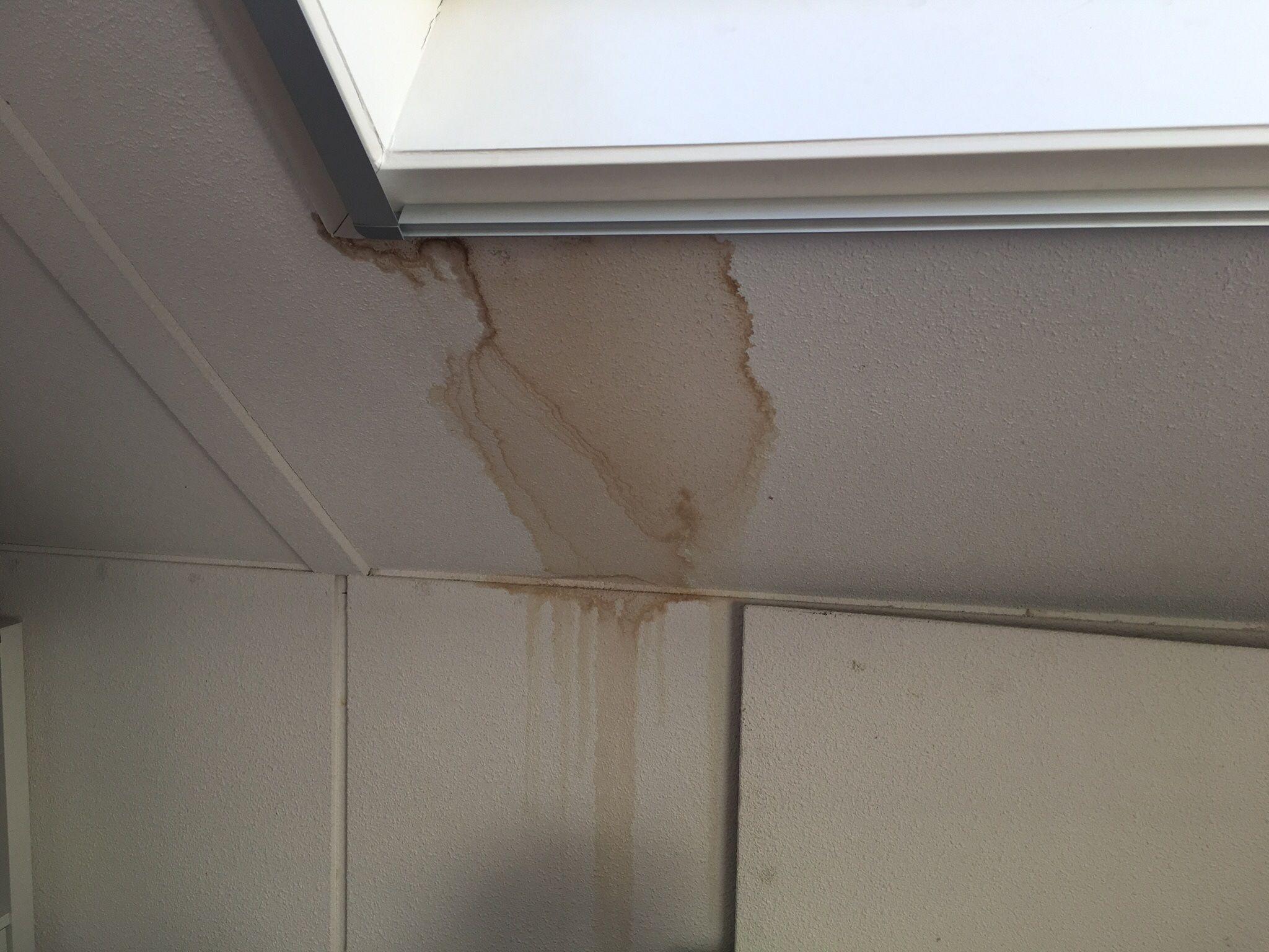Ceiling water stain below a vaulted ceiling in a Boerne home