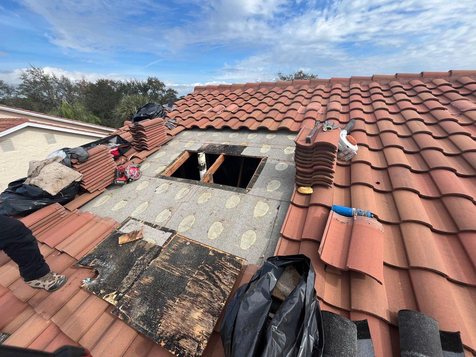 Clay tile lift and relay with new underlayment, The Dominion