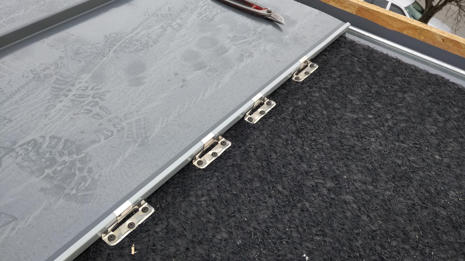 Detail of standing seam panels and concealed clips on a Boerne metal roof