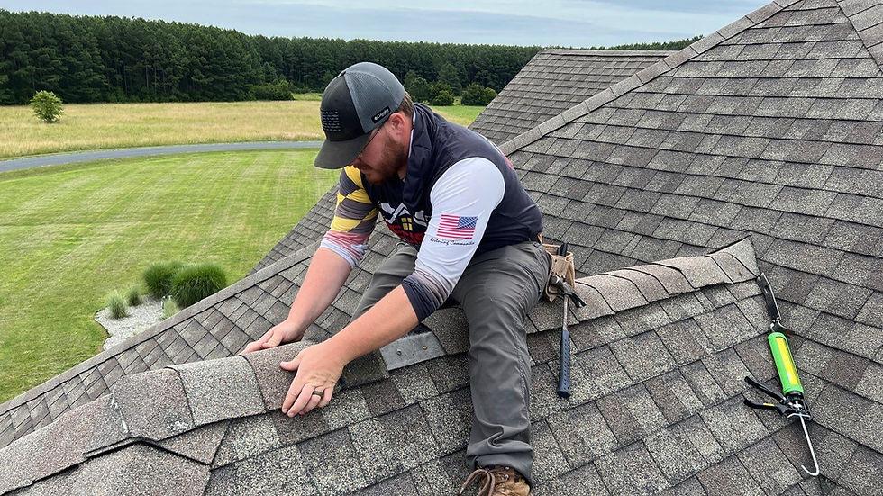 A1 Boerne roofer replacing wind-damaged shingles along a ridge on a Boerne home
