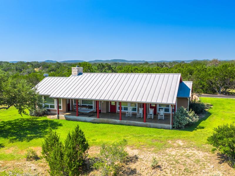 New standing seam metal roof on a Medina River ranch home near Bandera