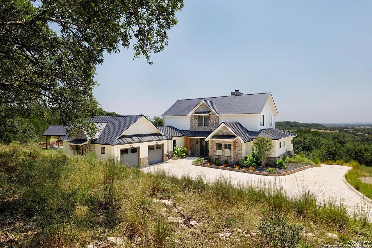 New standing seam metal roof on a ridgeline home in Mystic Shores, Spring Branch